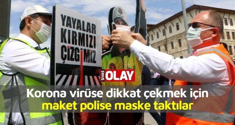 Korona virüse dikkat çekmek için maket polisin ağzına maske taktılar